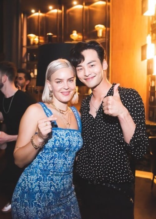 Kim Min-jae as seen while posing for a picture alongside Anne-Marie in July 2019