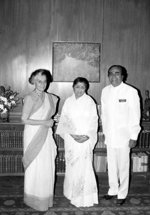 Lata Mangeshkar (Center) as seen in a picture alongside the former Prime Minister Smt. Indira Gandhi and the former Minister of State for Steel and Mines Shri N.K.P. Salve in September 1984