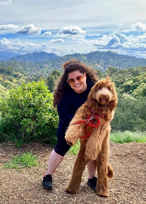 Marissa Jaret Winokur posing for a picture with her dog at Fryman Canyon Trailhead in Los Angeles, California, United States in March 2019