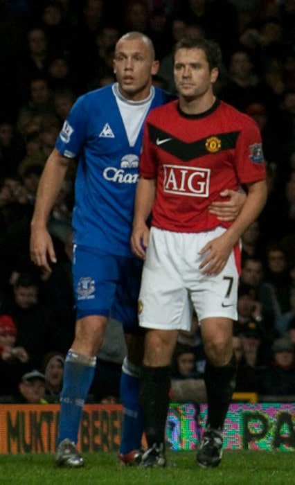 Michael Owen and Johnny Heitinga as seen in November 2009