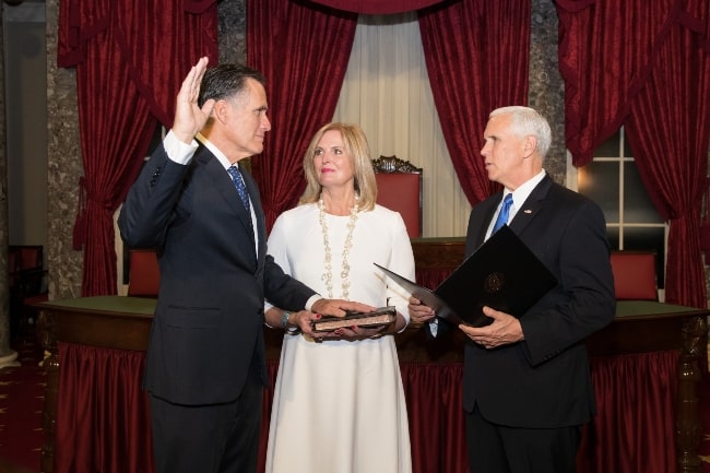 Mitt Romney (Left) being sworn in as a United States Senator from Utah by Vice President Mike Pence in the presence of Ann Romney in January 2019