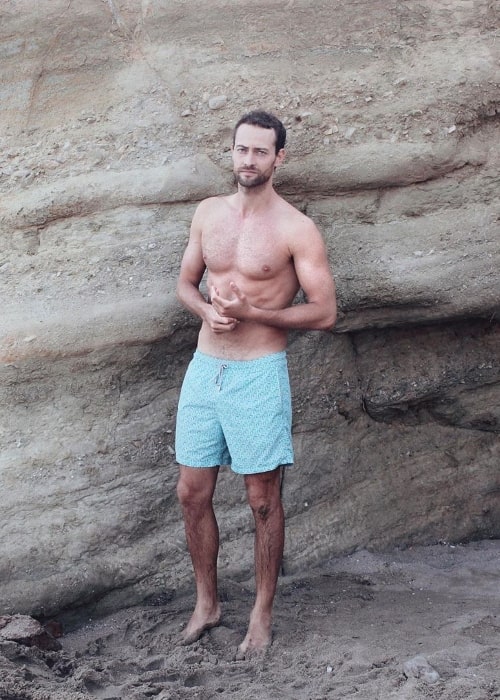 Peter Vives as seen while posing shirtless for the camera at Kalogeros Beach in Greece in August 2019