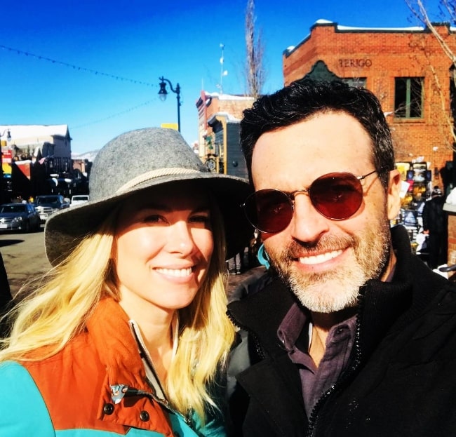 Reid Scott smiling in a picture alongside wife Elspeth Keller Scott