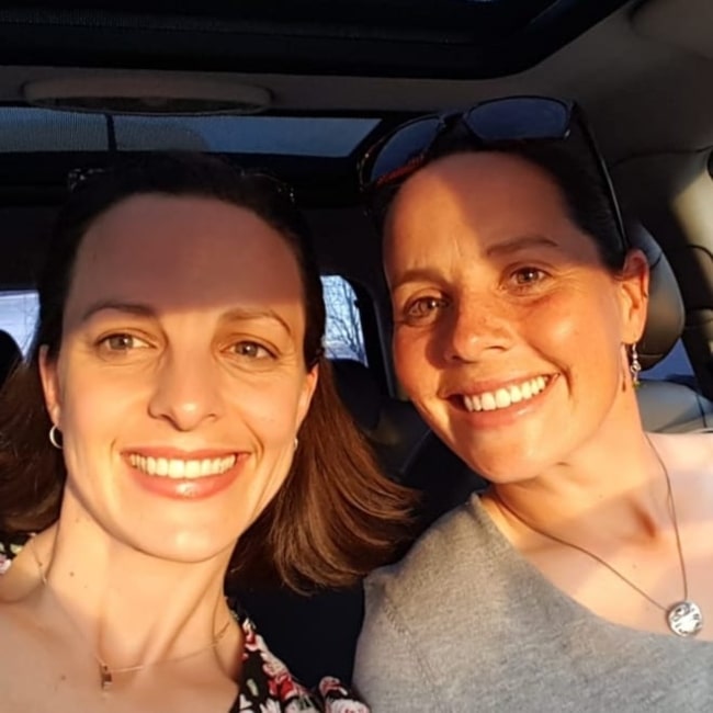 Rhian Wilkinson as seen in a selfie taken with her sister S. Wilkinson while on thier way to an event of Former First Laday Michelle Obama in March 2019