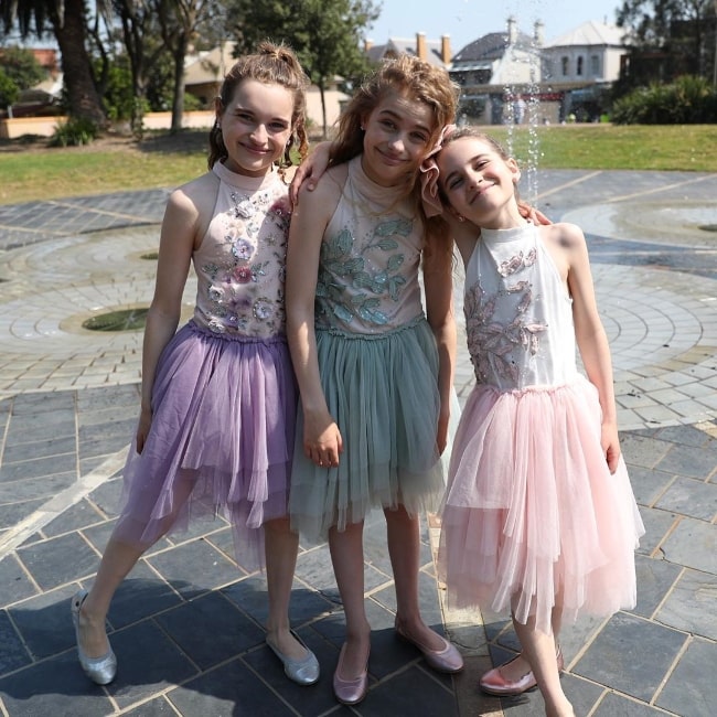 Sockie Norris as seen while posing for the camera alongside her sisters, Sabre Norris (Left) and Naz Norris (Right), in November 2019