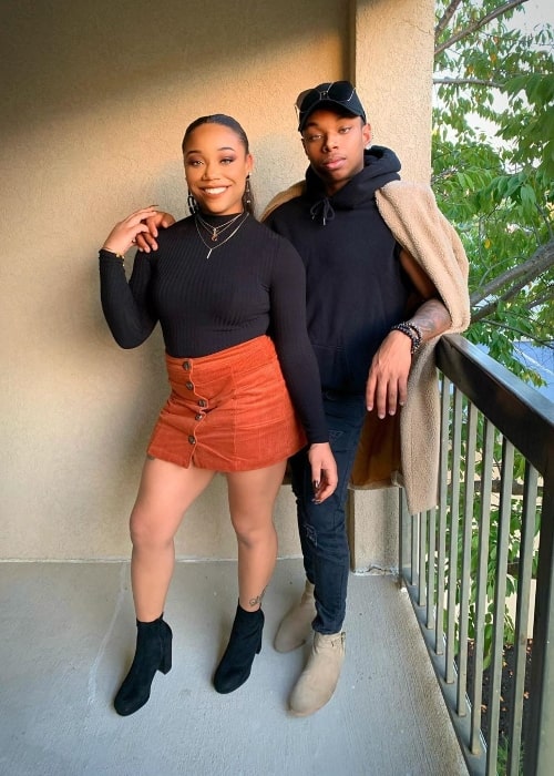 Tré Melvin posing for a picture alongside his sister Kaylah Melvin