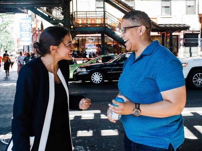 Alexandria Ocasio-Cortez (Left) as seen while talking with Kerri Evelyn Harris in September 2018