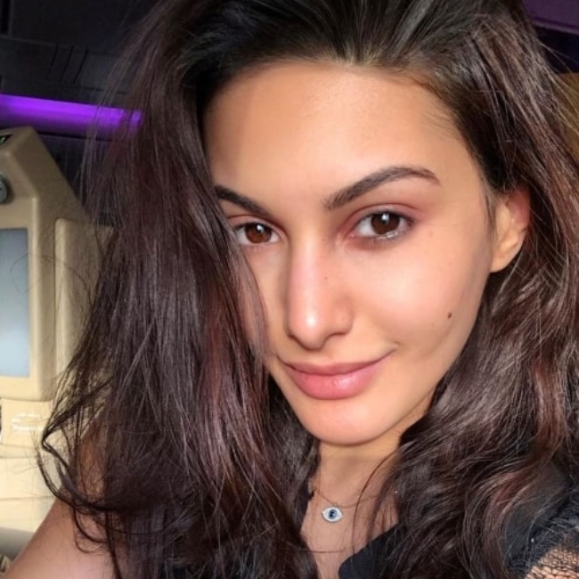 Amyra Dastur sharing the candid travel-selfie that she took at Abu Dhabi International Airport in June 2019