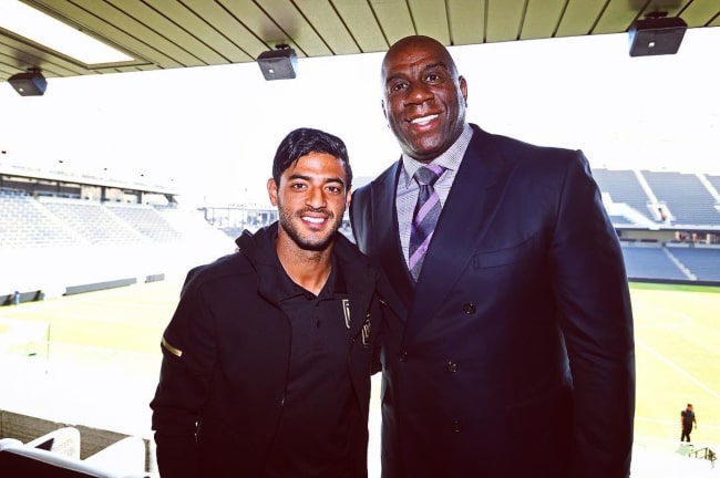 Carlos Vela with basketball legend Magic Johnson, as seen in April 2018