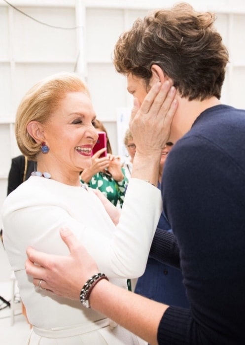 Carolina Herrera caught in a jovial mood backstage congratulating a creative director after the Spring 2020 runway show