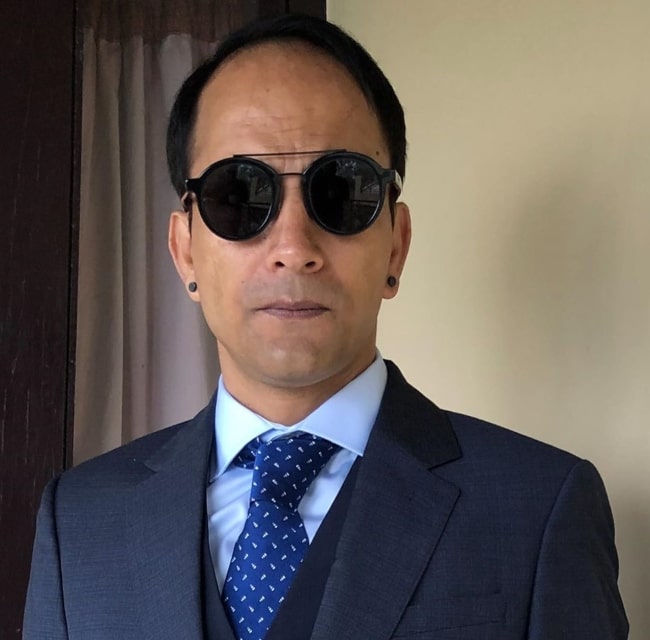 Deepak Dobriyal posing for a photo in his new look in November 2019