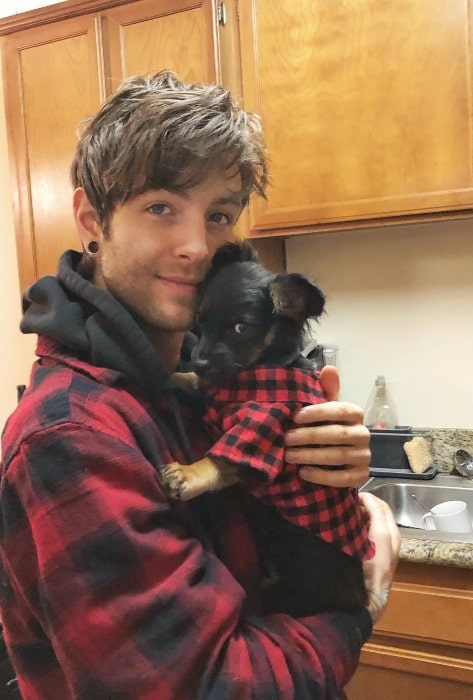 Drew Chadwick as seen while posing for a picture with a puppy in February 2019