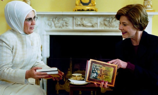 Emine Erdoğan (Left) as seen while presenting books of poetry by Persian poet Rumi to Laura Bush during a coffee at the White House on January 29, 2004