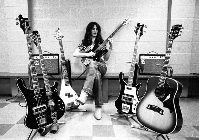 Geddy Lee on tour with various basses and an acoustic guitar