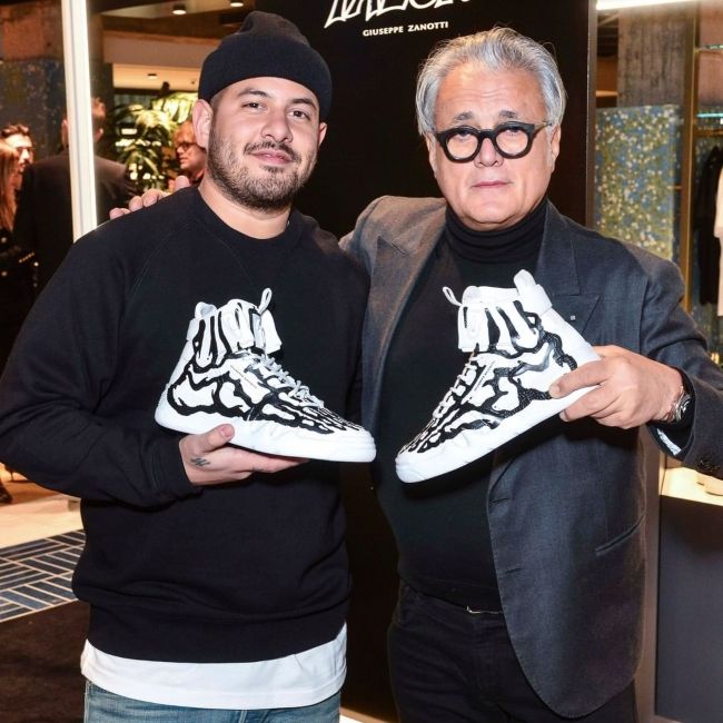 Giuseppe Zanotti seen with Joshua Vides during the launch of the Talon sneaker in 2020