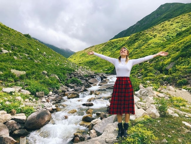 Gizem Karaca as seen while posing amidst the beautiful natural landscape in July 2019