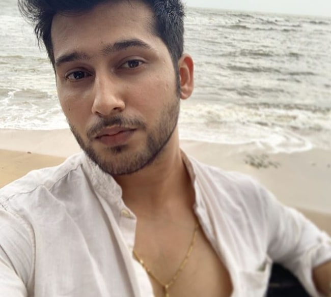 Namish Taneja in a candid selfie at a beach in 2019