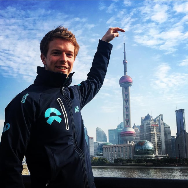 Oliver Turvey posing in front of the Oriental Pearl TV Tower in in Shanghai in December 2017
