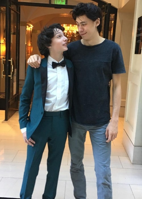 Owen Teague (Right) as seen while posing for a picture along with Finn Wolfhard in January 2017