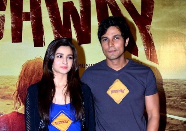 Randeep posing with Alia Bhatt for the first look launch of their film Highway