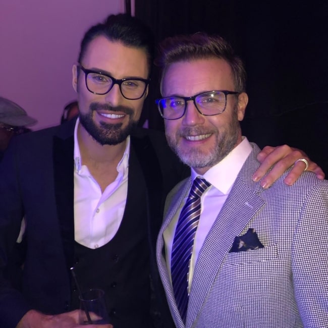 Rylan Clark-Neal as seen in a picture taken with singer and songwriter Gary Barlow in October 2019