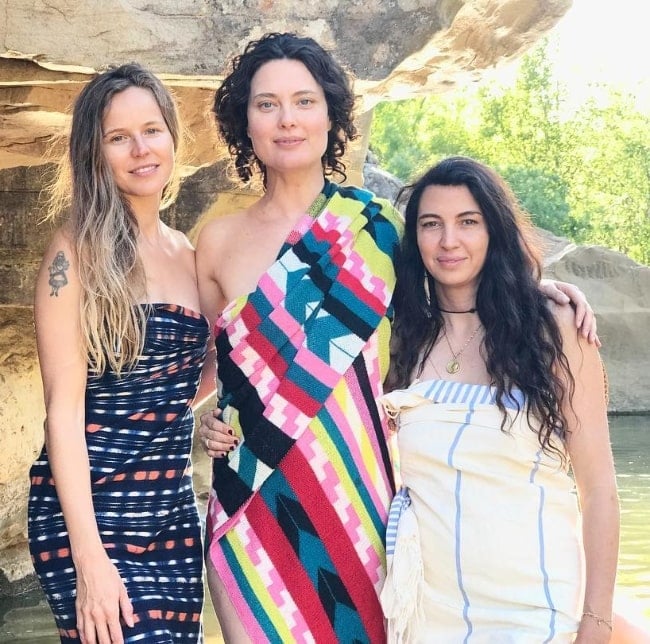 Shalom Harlow posing for a picture alongside Sadie Adams (Left) and Shiva Rose (Right) in April 2019