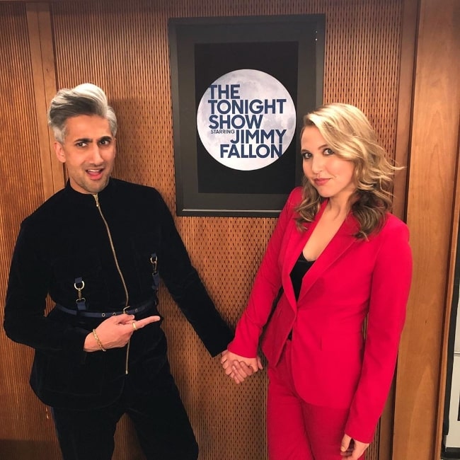 Taylor Tomlinson as seen while holding hands and posing for the camera along with Tan France during their time at 'The Tonight Show Starring Jimmy Fallon' in March 2020