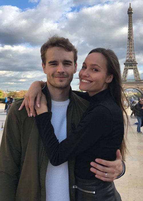 Tom Dillmann and Nicolle Taketa Schneider posing in front of the Eiffel Tower on Valentine's day in 2020