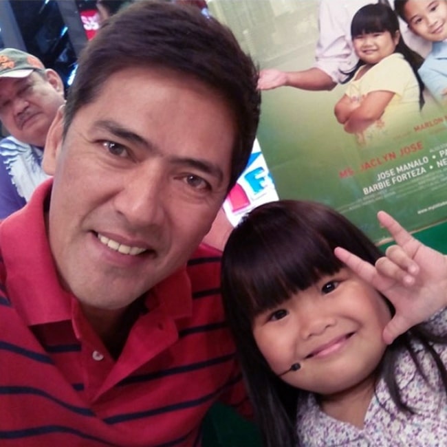 Vic Sotto as seen in a picture taken with Ryzza Mae Dizon during Bossing's Birthday Celebration on Eat Bulaga in February 2014