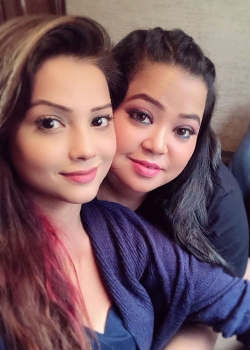 Adaa Khan (Left) as seen while taking a selfie along with comedian Bharti Singh in August 2019