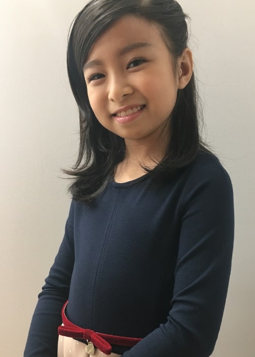 Celine Tam as seen while smiling for the camera in October 2017