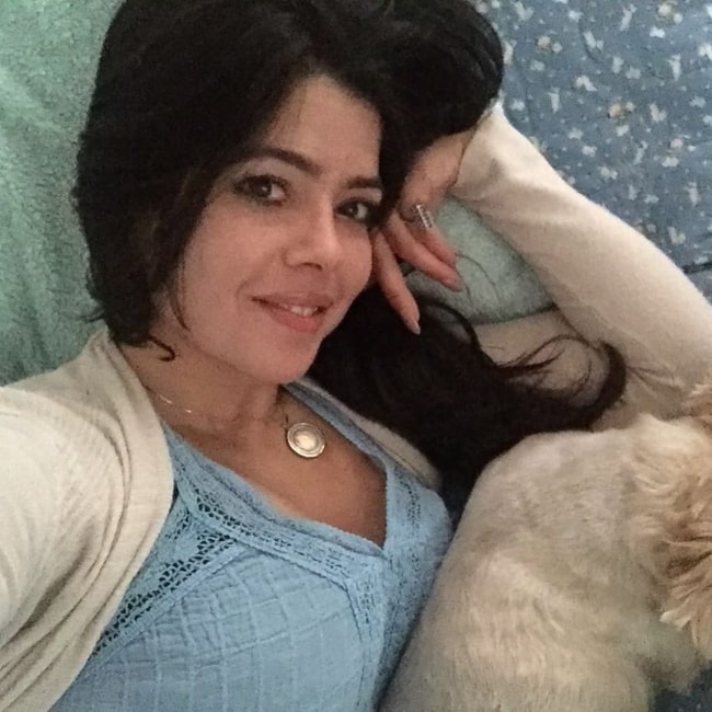 Darlene Tejeiro as seen in a selfie taken while cuddling with her dog Ritzie in June 2019
