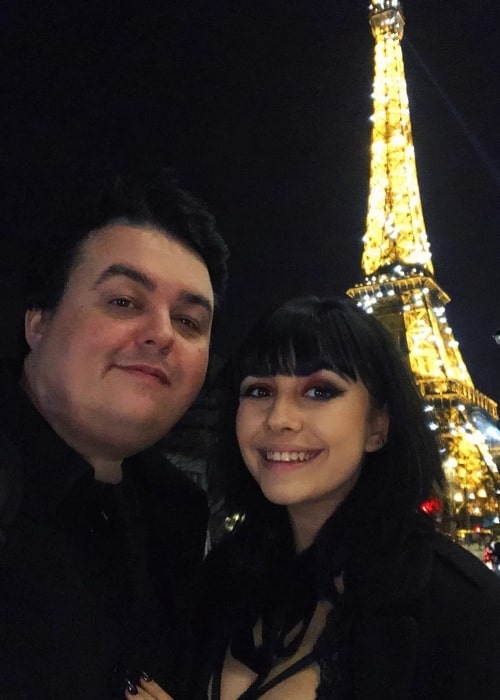 Daz Black smiling in a selfie alongside Soheila Clifford at Eiffel Tower in Paris, France in February 2020