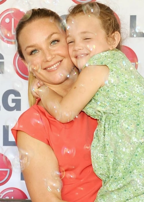 Elisabeth Röhm as seen in a picture taken with her __Daughter at the LG Washing Machine Drum, The Happiness of the United States 150 Million Women Keeper! in June 2012