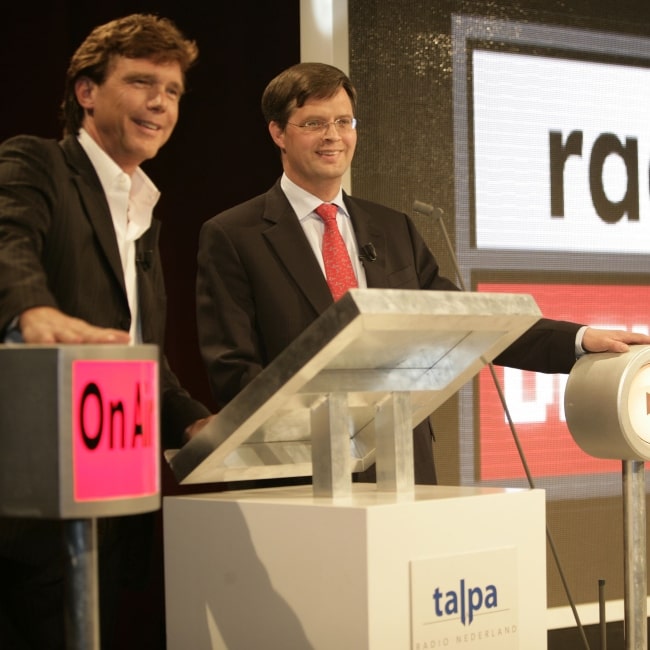 Jan Peter Balkenende and John de Mol Jr. as seen in a picture taken during the opening event of Radio Digitaal on April 26, 2004