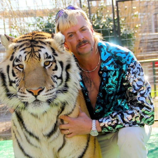 Joe Exotic as seen while posing for a picture alongside a tiger