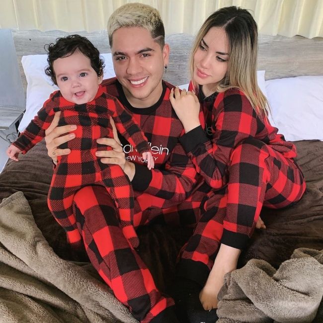 Juan seen with his wife and daughter in November 2019
