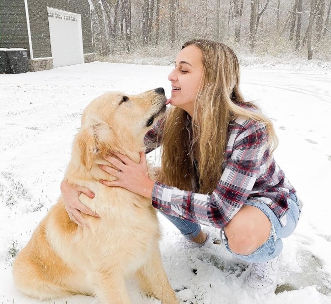 Karli Reese as seen in a picture with her dog while enjoying the snow in November 2019