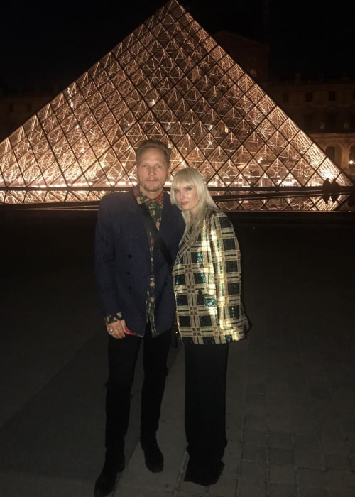 Matt Sorum and Adriane “Ace” Harper, posing in front of The Louvre in Paris in June 2019