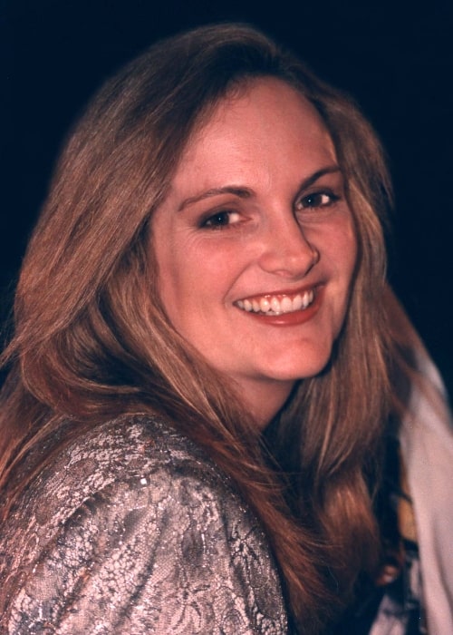 Patty Hearst smiling for a picture at Senator theater