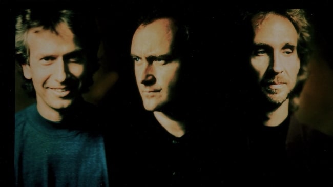 Phil Collins with his two 'Genesis' bandmates, Tony Banks (Left) and Mike Rutherford (Right), in 1991