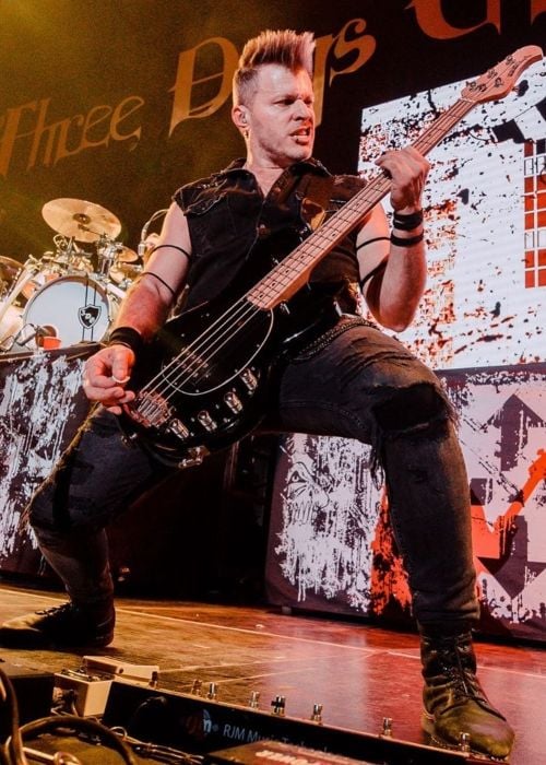 Brad Walst performing onstage with Three Days Grace