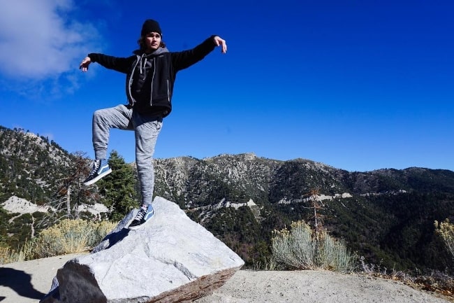 Chase Stokes posing for a picture at Big Bear Lake, California in November 2018