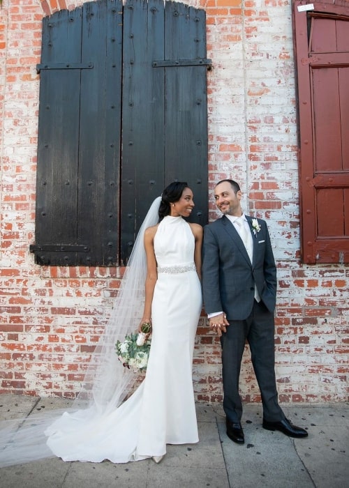 Enisha Brewster as seen in a picture taken with her husband Giuseppe Russo on the day of their wedding on June 23, 2019