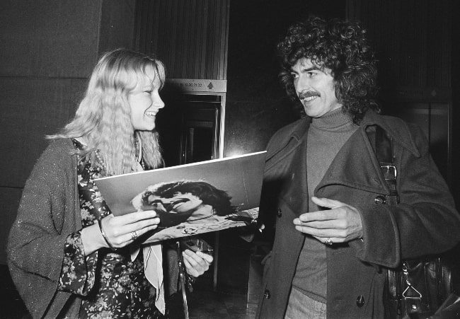 George Harrison as seen while leaving the Hilton Hotel in Amsterdam and signing an album for a fan in February 1977