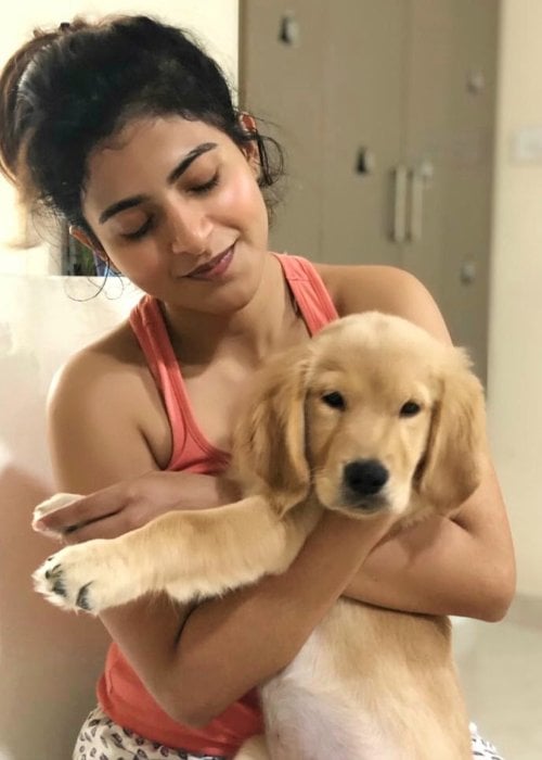 Iswarya Menon with her dog Coffee in April 2020