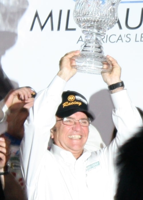 Jack Roush holding the winner's trophy after one of his drivers won the race at the Milwaukee Mile in June 2009