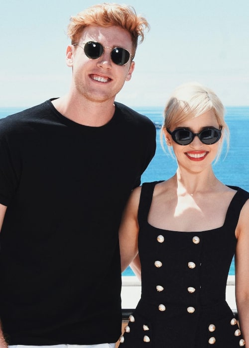 Josh Pieters posing for the camera along with Emilia Clarke in Cannes, France in May 2018