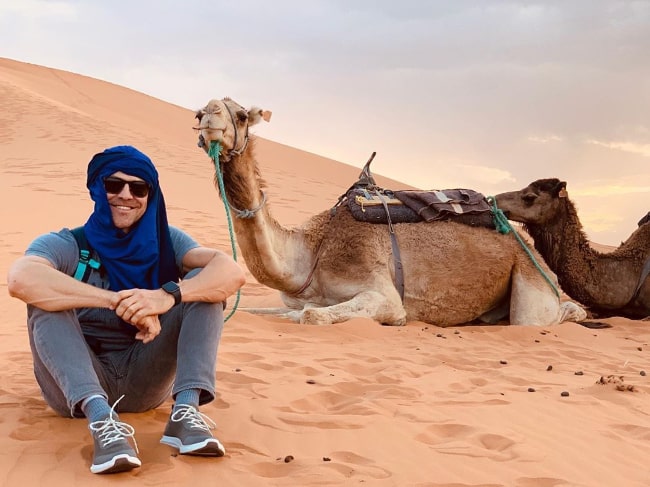 Kyle Howard posing for the camera in Sahara Desert, Morocco in June 2019