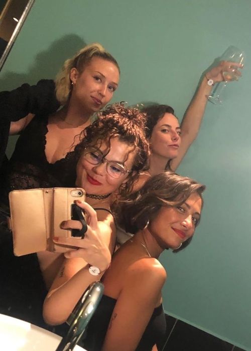 Lily seen with her Skins co-stars Kaya Scodelario, Megan Prescott, and Klariza Clayton in 2019